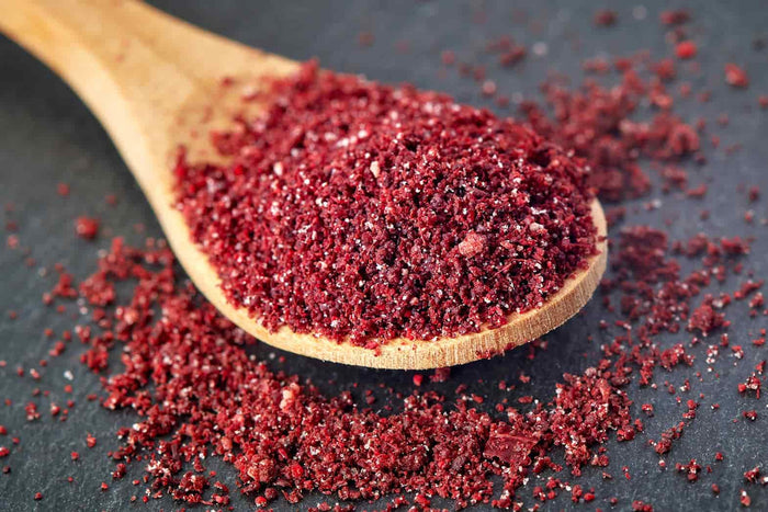 Ground Sumac in a wooden spoon