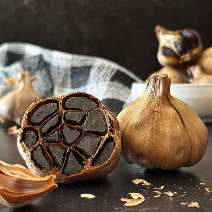 Black Garlic displayed on  a table