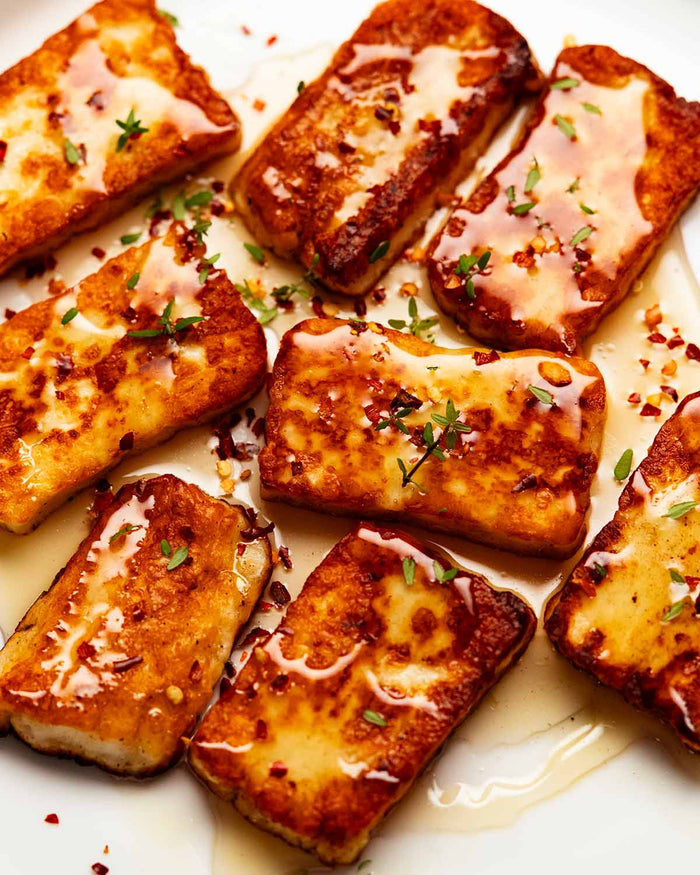 Baked Halloumi in Olive Oil with fennel salt and honey drizzled