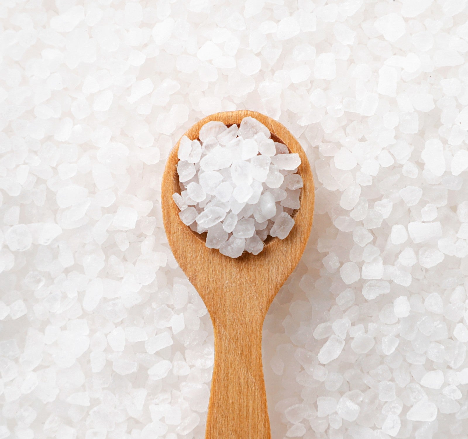 Wooden spoon with sea salt