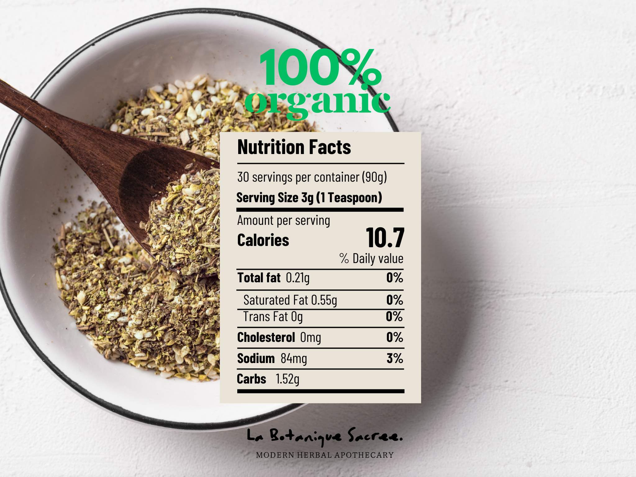 Herbal mix in a bowl with a wooden spoon and nutrition facts label on a white background